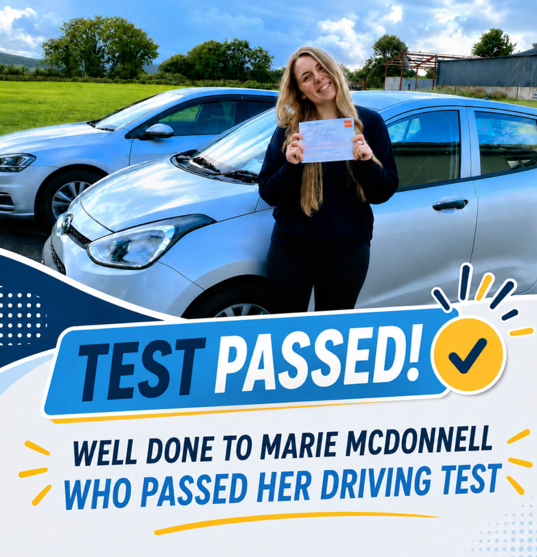 Marie McDonnell holding her driving test pass certificate with Drive with Clive
