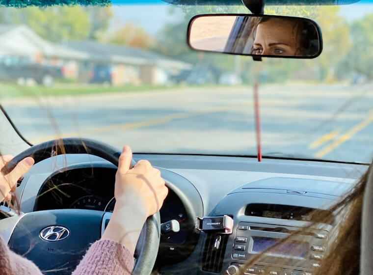 Learner driver driving on a rural road during a lesson